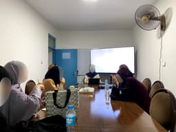 A seminar session, faces blurred